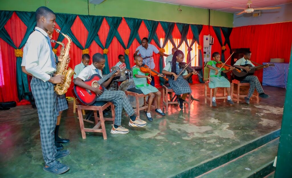 The Cityside school band performing on saxophone, guitar and keyboard