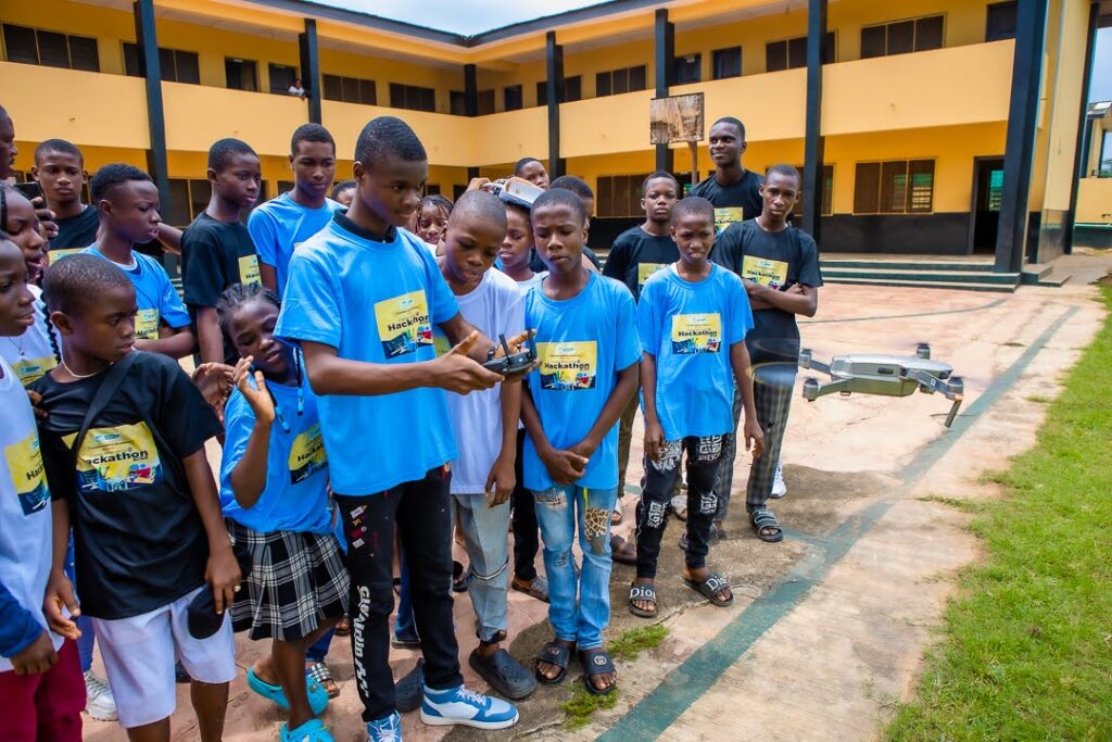 Cityside students with drones in the school courtyard during the Digital Bootcamp